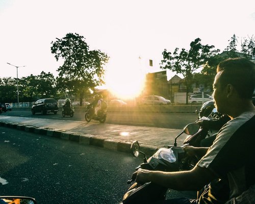 Daily urban commute in Indonesia morning sun